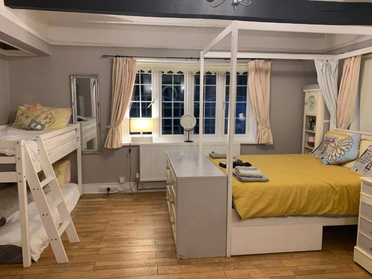 A family room at Hazelwick with bunk beds and a double bed