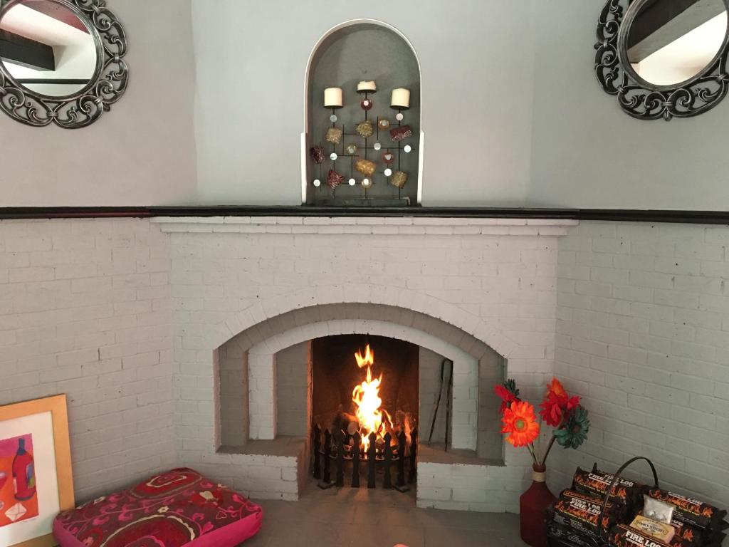A fire lit in Hazelwick's arched fireplace